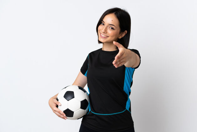比赛年轻的足球运动员女子孤立在白色背景握手成交好合作交易合作伙伴