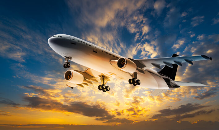 翅膀在日落的天空中飞行的运输飞机旅行商业黄昏