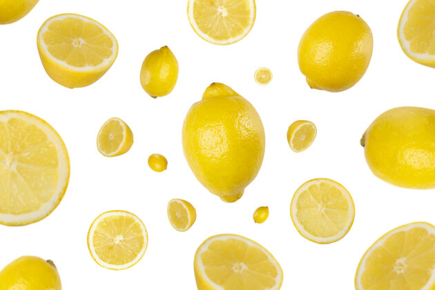 柠檬许多柠檬和柠檬片飞落在地上水果片柠檬柑橘