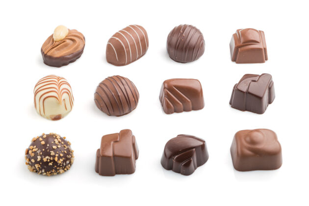 浪漫不同的巧克力糖果隔离在白色的表面坚果可可糖果