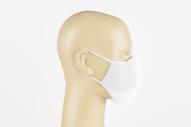 空气污染人体模型上的白色织物面罩病毒爆发复制空间头部