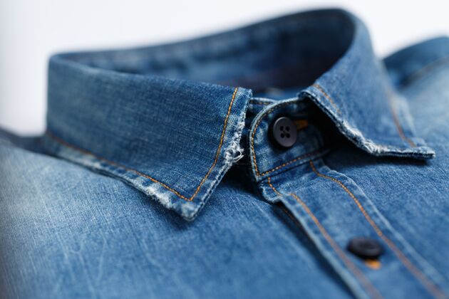 线一个优雅的 熨烫过的蓝色牛仔男式衬衫领子的特写镜头材料吸引力服装