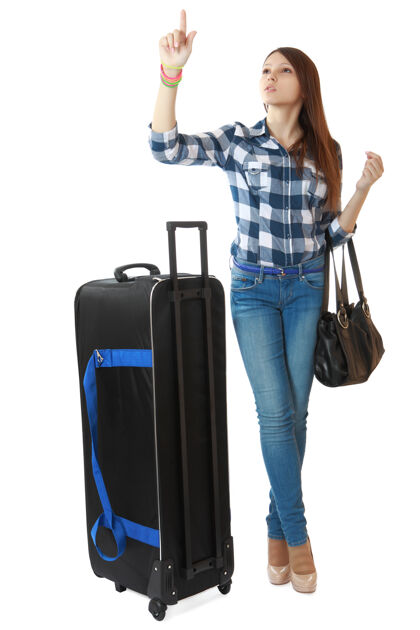 度假16岁的小女孩 带着黑色的大旅行包旅游手提箱黑色包