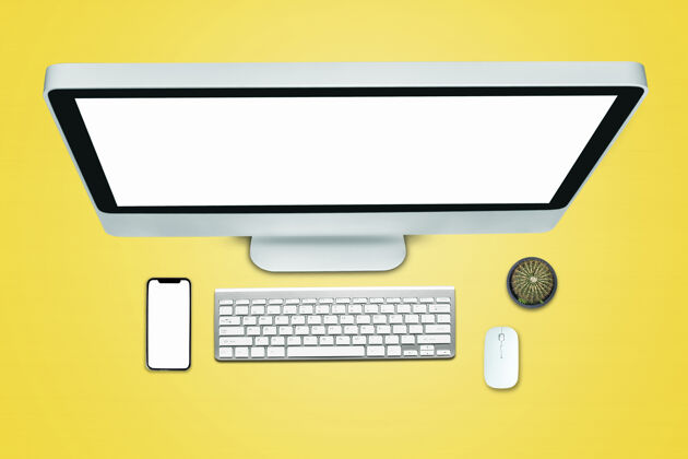 Pc平板电脑 智能手机 笔记本电脑的顶视图 黄色背景 办公室风格教育科技键盘