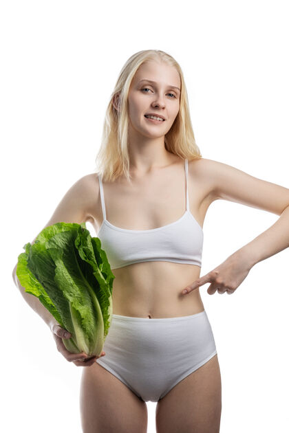 测量素食女性吃健康食品的概念和美味食品保健医疗植物基地的概念腰部白人举行