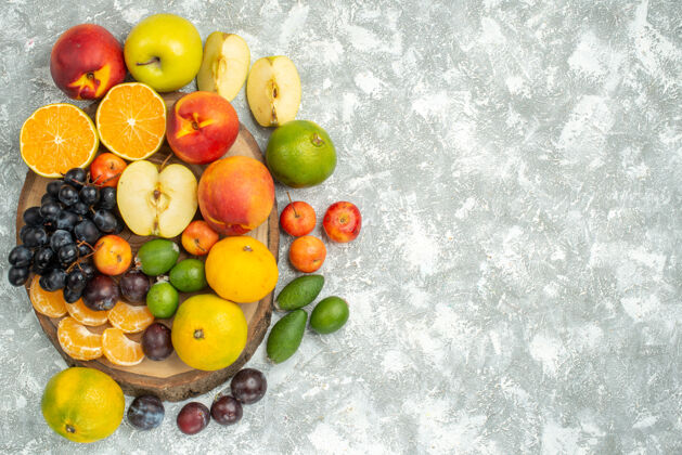 可食用水果顶视图不同的水果组成切片和整个新鲜水果的白色背景树维生素成熟水果醇厚的颜色切片成熟观点