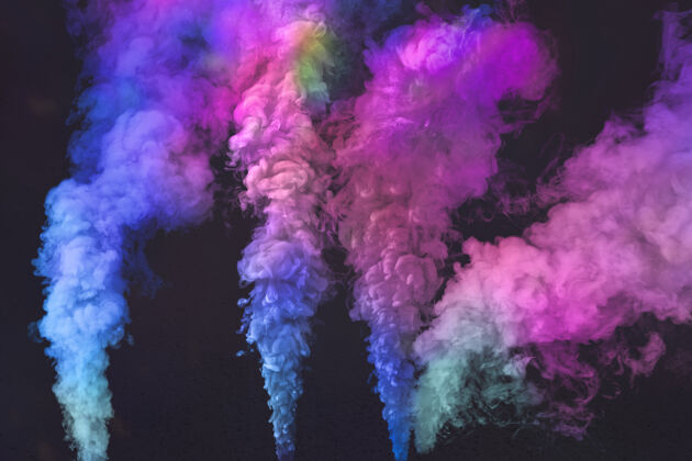 烟雾黑色背景上的粉红色和蓝色烟雾效果运动烟雾效果