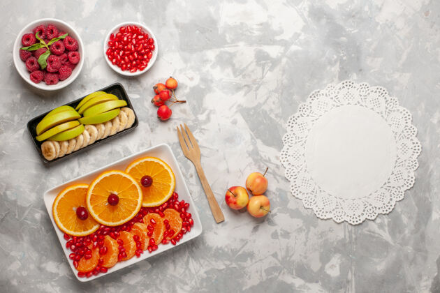 桌子顶视图切片橙子与树莓上的光桌水果浆果多汁醇厚视野盘子切片