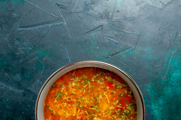 蔬菜顶视图美味的蔬菜汤内板上深绿色的背景食品蔬菜配料汤产品餐生的餐厅西红柿