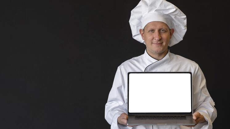 自制中枪厨师拿着笔记本电脑笔记本电脑烹饪厨师