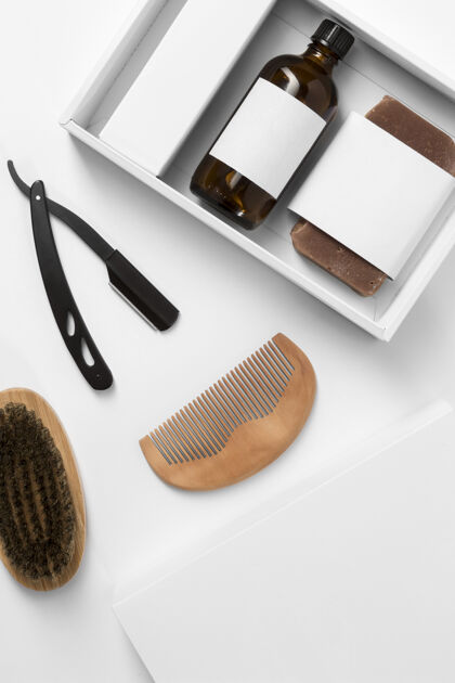 男性带洗发水和梳子的理发店产品盒顶视图美容院胡须胡须护理